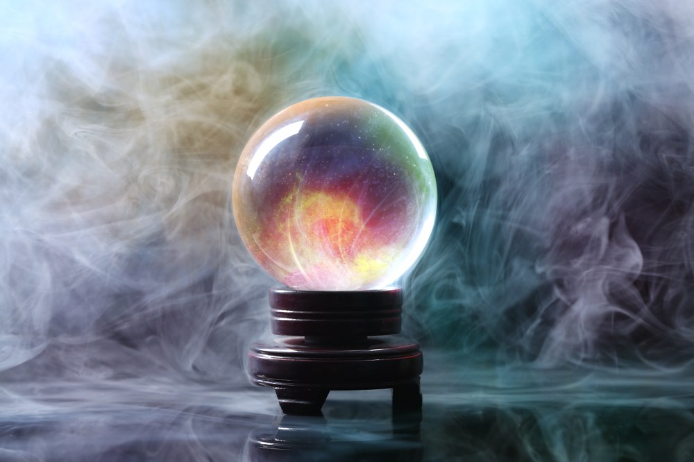 @Pixel-Shot_AdobeStock_403016347_Crystal ball of fortune teller in smoke on table .jpeg